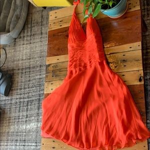Orange Marilyn Monroe style cocktail length dress